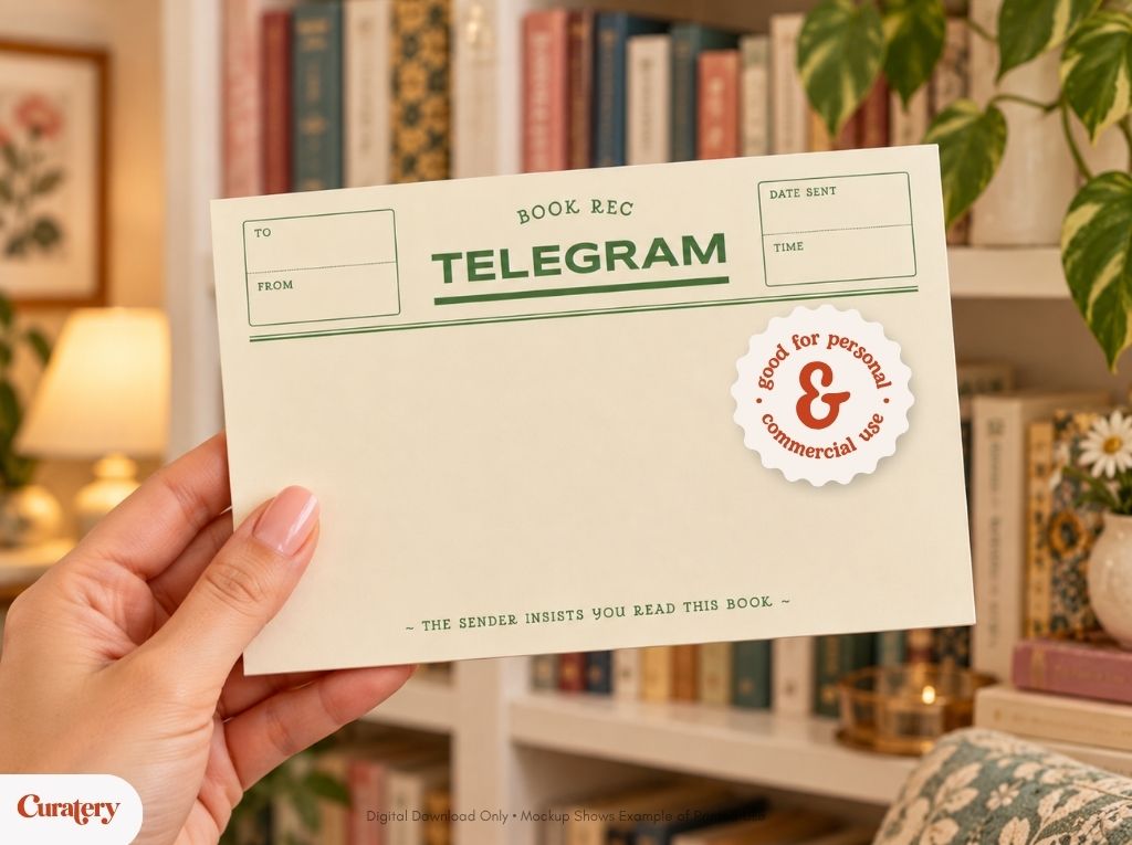 A hand holds a cream-colored card designed like a telegram with fields for "TO", "FROM", "DATE SENT", "TIME", and the text "BOOK REC TELEGRAM", "THE SENDER INSISTS YOU READ THIS BOOK", and a sticker that says "good for personal & commercial use", against a blurred background of a bookshelf.