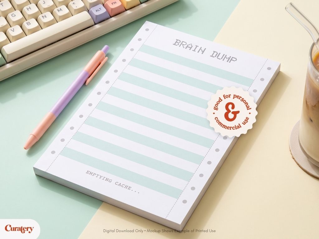 A pastel-striped notepad titled "BRAIN DUMP" and "EMPTYING CACHE..." is displayed with a pink and purple pen, a keyboard, and a drink, featuring a sticker that reads "good for personal & commercial use."