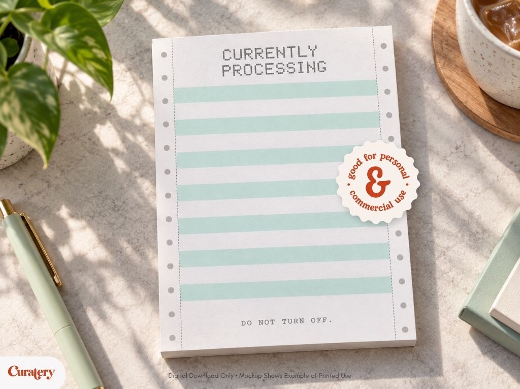A notepad designed like continuous form paper displays "CURRENTLY PROCESSING" at the top, "DO NOT TURN OFF." at the bottom, and a circular sticker stating "good for personal & commercial use."