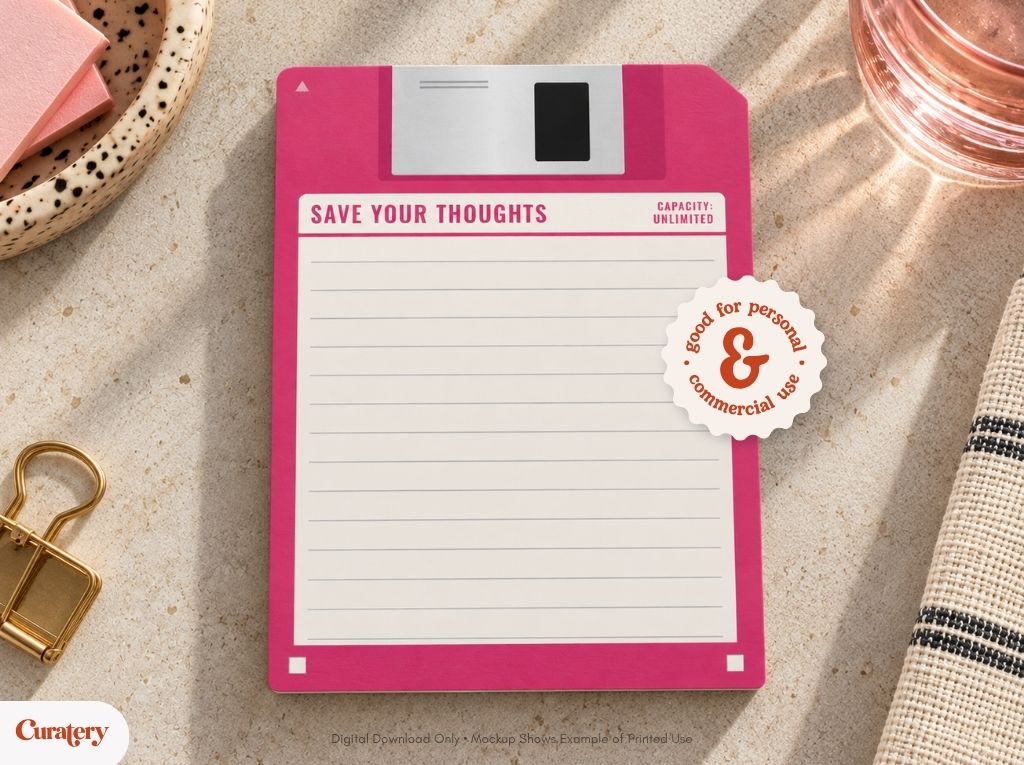 A pink floppy disk-shaped notepad with lines for writing is displayed on a textured surface, featuring text that reads "SAVE YOUR THOUGHTS," "CAPACITY: UNLIMITED," and a circular sticker stating "good for personal & commercial use."